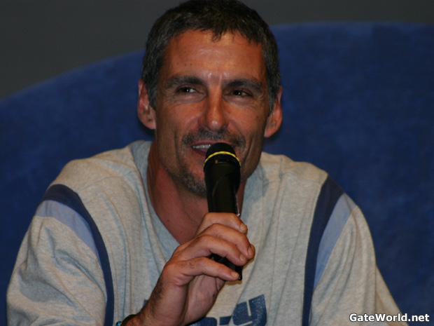 Cliff explains that we have many Baals to look forward to in an upcoming episode, where he once again frustrates SG-1.He also explained how he brought his own sense of humour to his characterisation of Baal, and how he delves into his own "dark side" to make Baal a more complex and appealing character -- despite his inherently evil nature.
