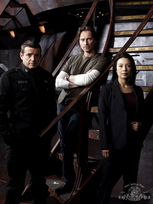 Everett Young (Louis Ferreira), Nicholas Rush (Robert Carlyle) and Camille Wray (Ming-Na)
