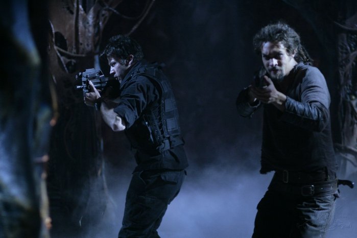 Hoping to recover their friend from Michael's captivity, Lt. Colonel John Sheppard (Joe Flanigan) and Ronon Dex (Jason Momoa) make their way through a Wraith facility.
