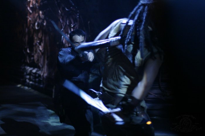 Ronon and Tyre engage in fierce hand-to-hand combat.
