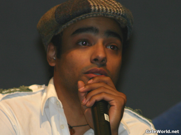 Rainbow explains how he came to get the role of Ford in Atlantis –- including a series of nine auditions in a week! Now that his character has been changed to recurring status, Rainbow is involved in an overwhelming array of pursuits, including working with his hip hop music group of 12 years (during which they have released six albums). He is also working on a solo record including one with his family (including father Don Franks, his mother Lili, and sister Cree).
