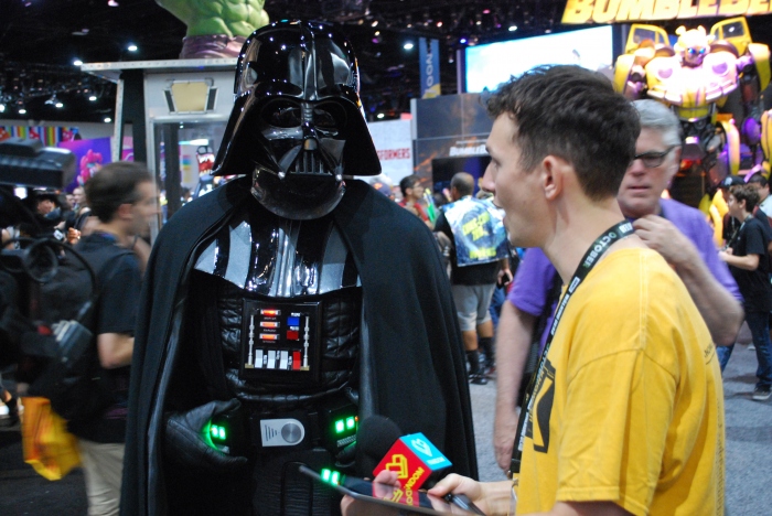 Darth Vader is interviewed on the floor of the exhibit hall
