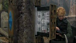 Carter accesses the inner workings of the device. From "The Quest, Part 2"