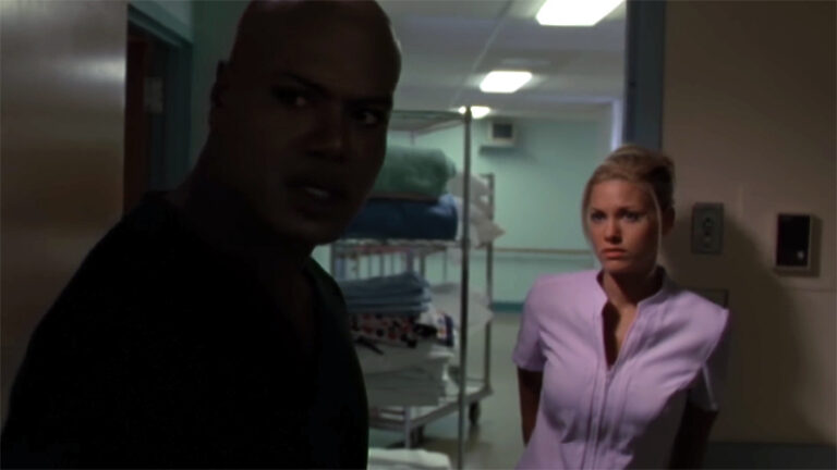 Teal'c and nurse (Christopher Judge and Gia Patton)