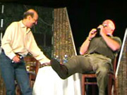 Avari topples his bottle of water after giving Don S. Davis a kiss on the cheek at Gatecon 2004.